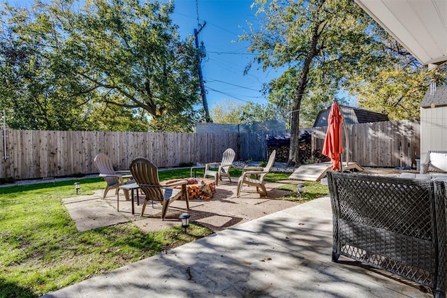 3424 NW 16th St, Oklahoma City, OK 73107 - fenced backyard featuring a patio area and an outdoor fire pit