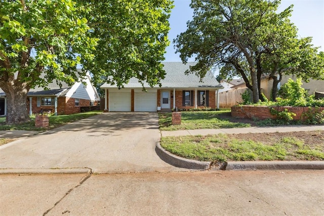 3513 Terry Way, Del City, OK 73115 - view of front of property featuring a garage, driveway, and brick siding