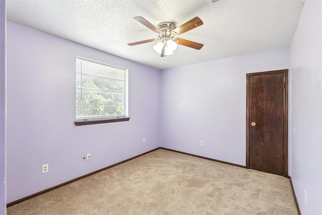3513 Terry Way, Del City, OK 73115 - spare room with carpet, a ceiling fan, and a textured ceiling