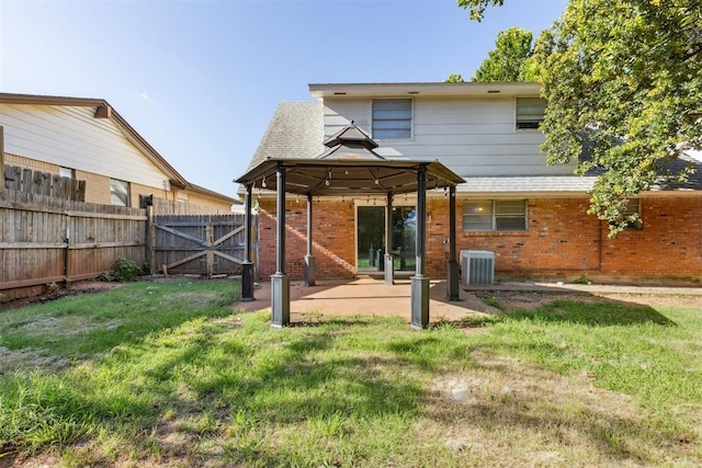 3513 Terry Way, Del City, OK 73115 - back of house with a gazebo, brick siding, a patio, and a gate