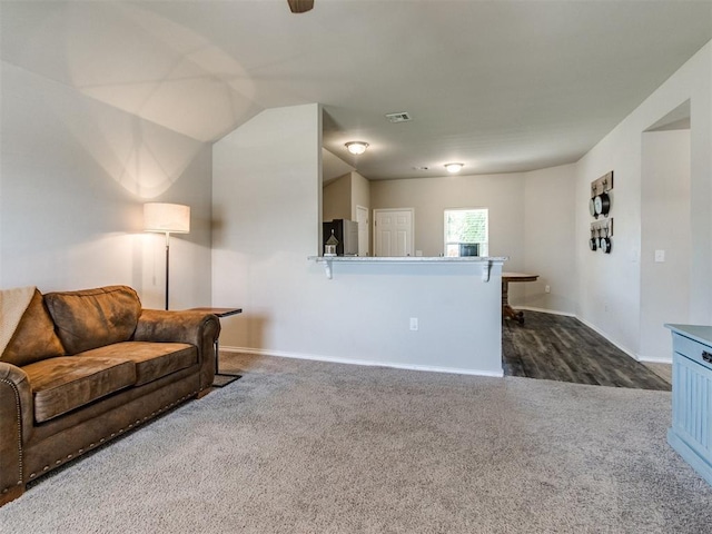 10408 NW 17th St, Oklahoma City, OK 73127 - living area featuring dark carpet and baseboards