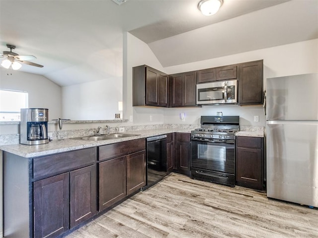 10408 NW 17th St, Oklahoma City, OK 73127 - kitchen featuring black appliances, vaulted ceiling, dark brown cabinetry, a ceiling fan, and light wood-style floors