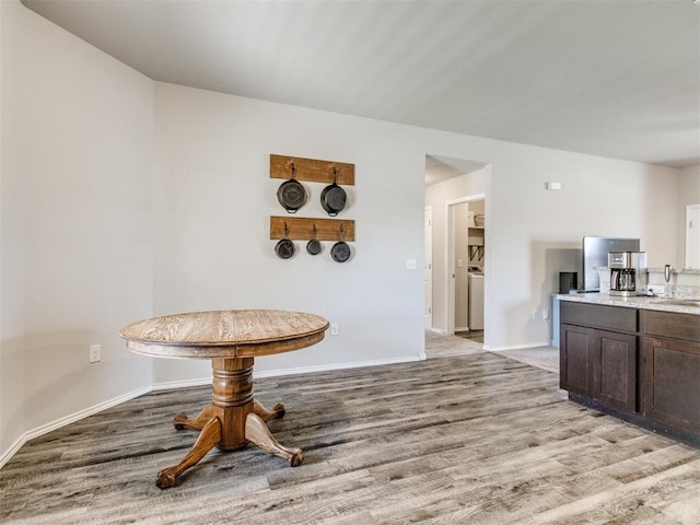 10408 NW 17th St, Oklahoma City, OK 73127 - dining area featuring light wood-style floors and washer / clothes dryer