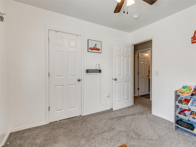 10408 NW 17th St, Oklahoma City, OK 73127 - carpeted bedroom with baseboards and a ceiling fan