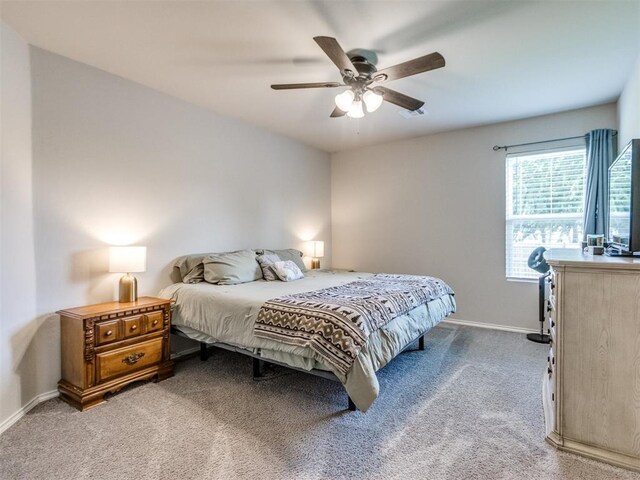 10408 NW 17th St, Oklahoma City, OK 73127 - bedroom featuring light colored carpet and a ceiling fan