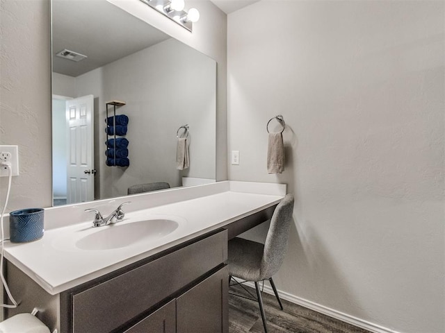 10408 NW 17th St, Oklahoma City, OK 73127 - bathroom with vanity and wood finished floors