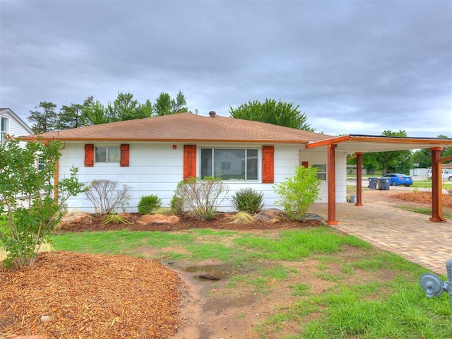 6908 NW 36th St, Bethany, OK 73008 - ranch-style home featuring a carport and driveway
