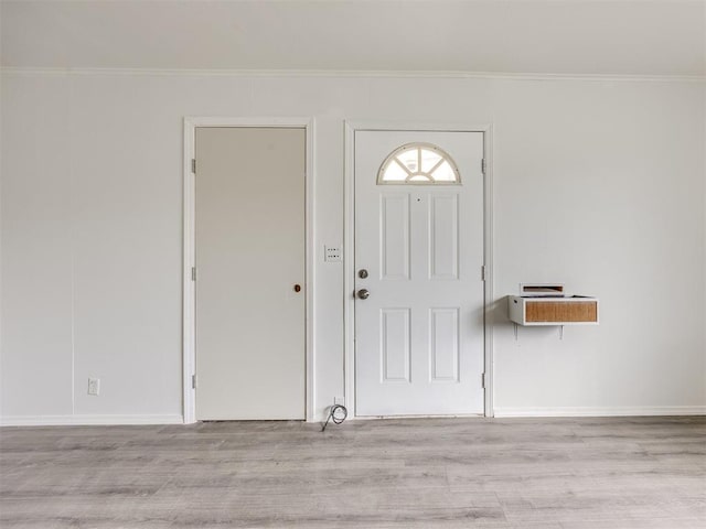 6908 NW 36th St, Bethany, OK 73008 - foyer featuring wood finished floors and ornamental molding