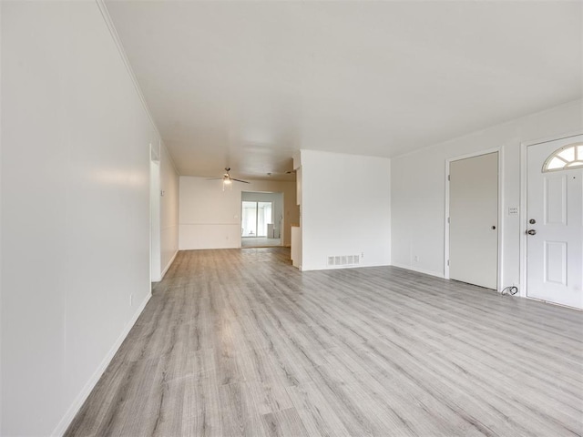 6908 NW 36th St, Bethany, OK 73008 - unfurnished living room featuring light wood-style floors and a ceiling fan