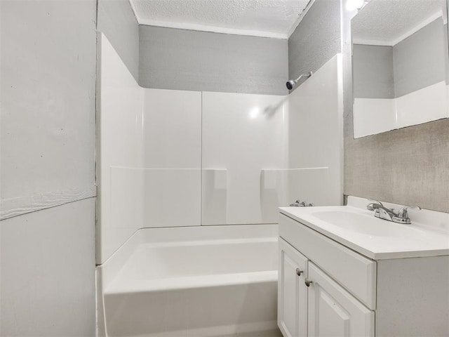 6908 NW 36th St, Bethany, OK 73008 - bathroom with vanity, shower / washtub combination, and a textured ceiling