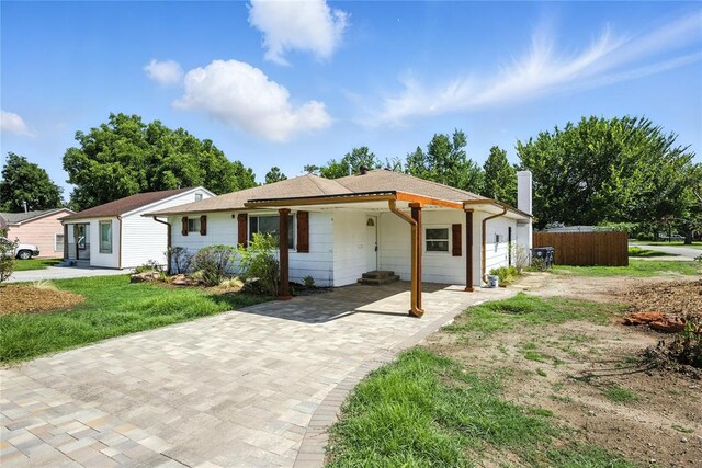 6908 NW 36th St, Bethany, OK 73008 - ranch-style house with a chimney