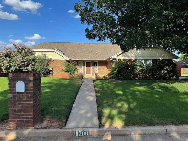 11700 Sierra Rd, Oklahoma City, OK 73162 - single story home with a front yard and brick siding