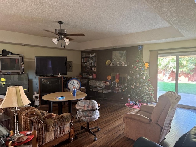 11700 Sierra Rd, Oklahoma City, OK 73162 - living room with a textured ceiling, wood finished floors, and ceiling fan