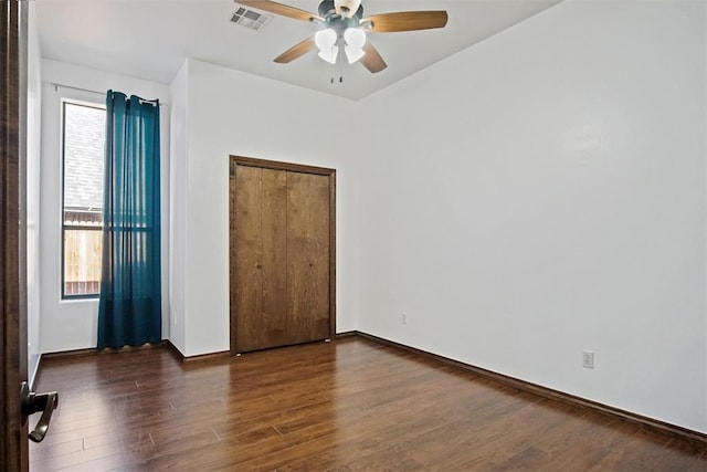 917 Erinova Dr, Yukon, OK 73099 - unfurnished bedroom featuring wood finished floors and a ceiling fan