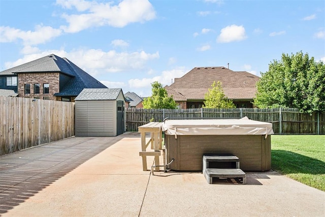 917 Erinova Dr, Yukon, OK 73099 - fenced backyard with a hot tub, a patio area, and a storage shed