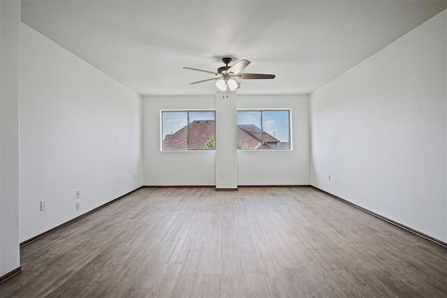 917 Erinova Dr, Yukon, OK 73099 - empty room featuring wood finished floors and a ceiling fan