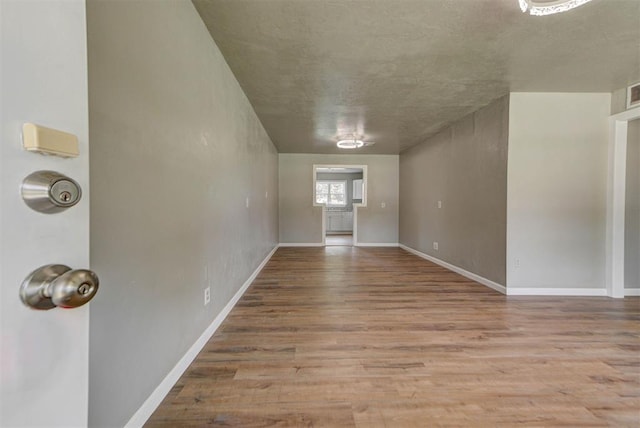 5417 NW 45th Ter, Warr Acres, OK 73122 - empty room featuring wood finished floors and baseboards