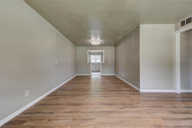 5417 NW 45th Ter, Warr Acres, OK 73122 - empty room with wood finished floors and baseboards