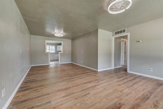 5417 NW 45th Ter, Warr Acres, OK 73122 - empty room with wood finished floors and baseboards