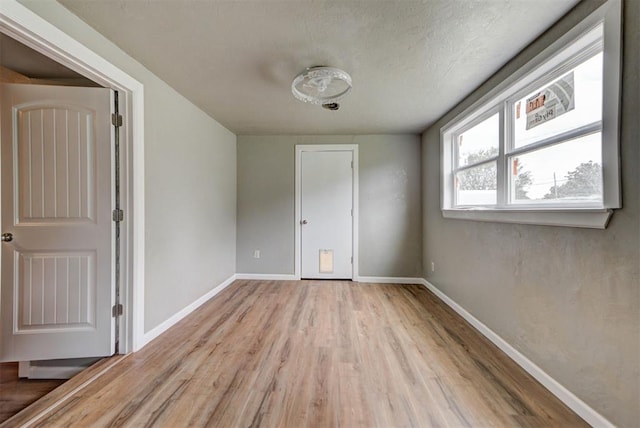5417 NW 45th Ter, Warr Acres, OK 73122 - unfurnished room featuring light wood-style floors and baseboards