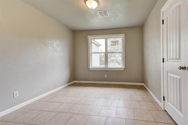 5417 NW 45th Ter, Warr Acres, OK 73122 - empty room with light tile patterned flooring and baseboards