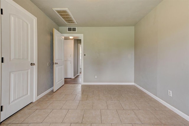 5417 NW 45th Ter, Warr Acres, OK 73122 - unfurnished room with light tile patterned flooring and baseboards