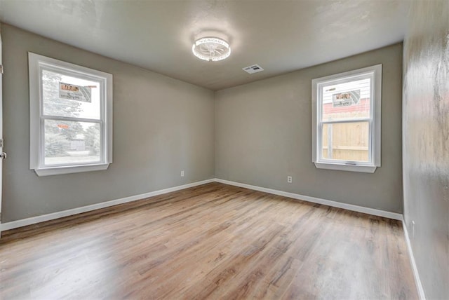 5417 NW 45th Ter, Warr Acres, OK 73122 - empty room featuring wood finished floors and baseboards