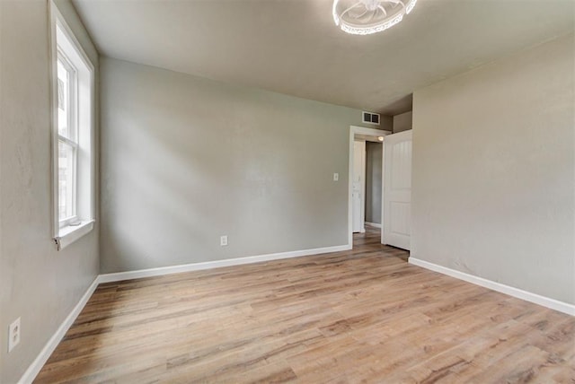 5417 NW 45th Ter, Warr Acres, OK 73122 - unfurnished room featuring plenty of natural light and light wood-style floors