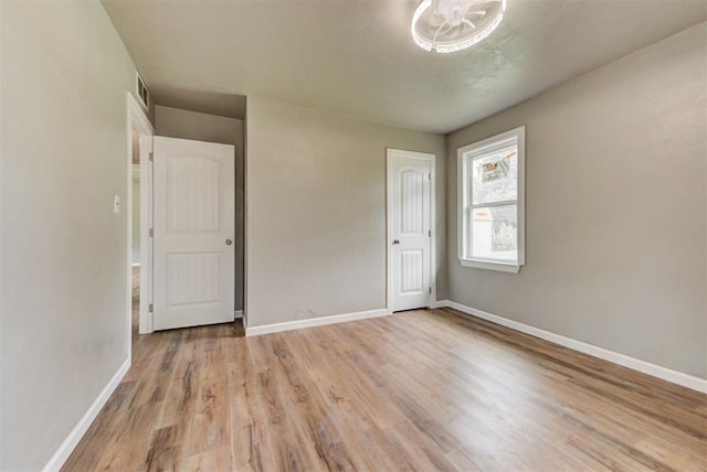 5417 NW 45th Ter, Warr Acres, OK 73122 - unfurnished bedroom featuring light wood finished floors and baseboards