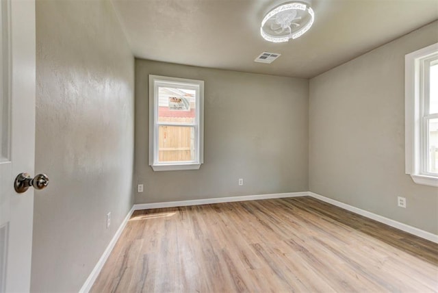 5417 NW 45th Ter, Warr Acres, OK 73122 - spare room featuring wood finished floors and baseboards