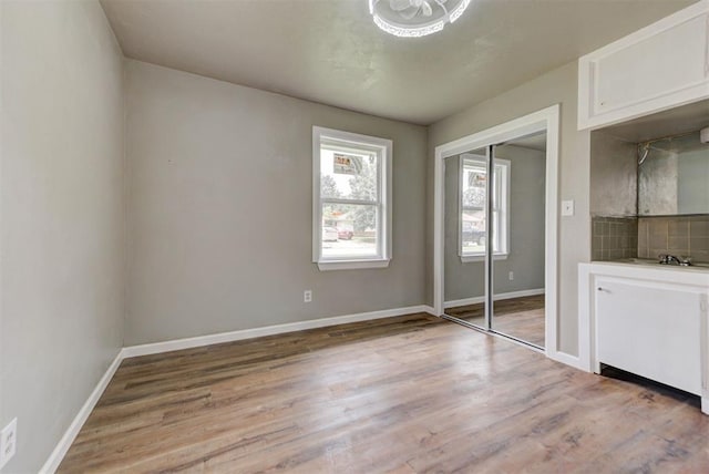 5417 NW 45th Ter, Warr Acres, OK 73122 - unfurnished bedroom featuring light wood-style floors and a closet
