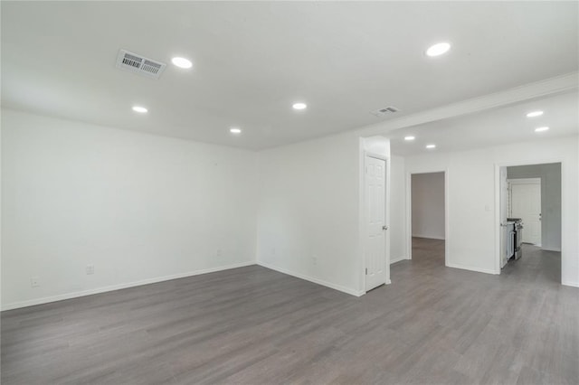 2220 SW 28th St, Oklahoma City, OK 73108 - spare room featuring wood finished floors and recessed lighting
