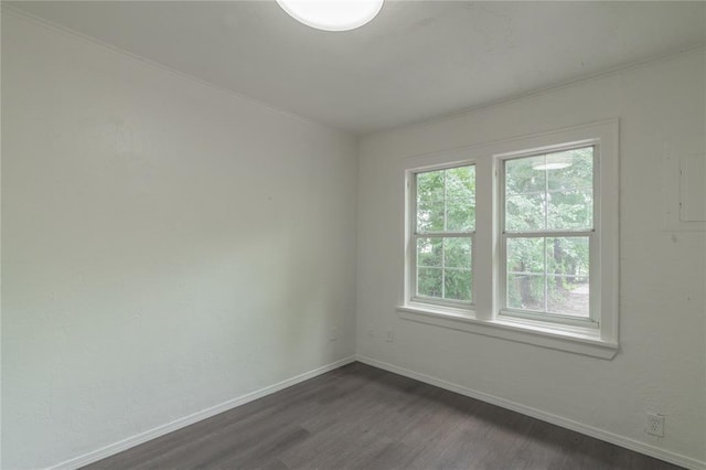 2220 SW 28th St, Oklahoma City, OK 73108 - empty room with dark wood finished floors and baseboards
