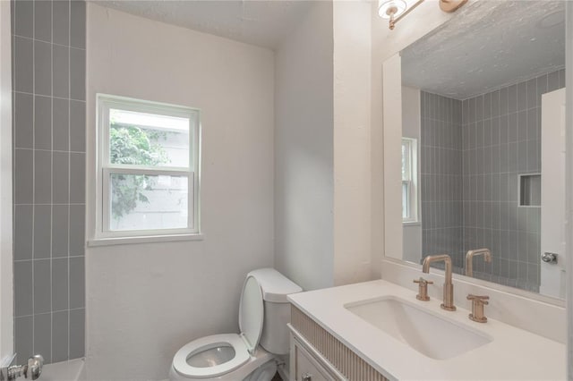 2220 SW 28th St, Oklahoma City, OK 73108 - full bathroom with vanity and a textured ceiling