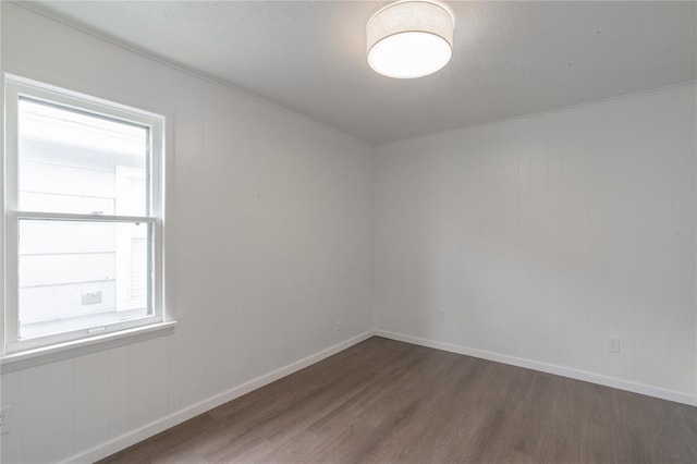 2220 SW 28th St, Oklahoma City, OK 73108 - unfurnished room with wood finished floors and baseboards