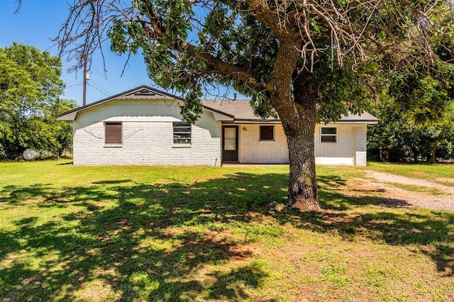 2120 E Robberts Ave, Kingfisher, OK 73750 - ranch-style home with brick siding, a front yard, and dirt driveway