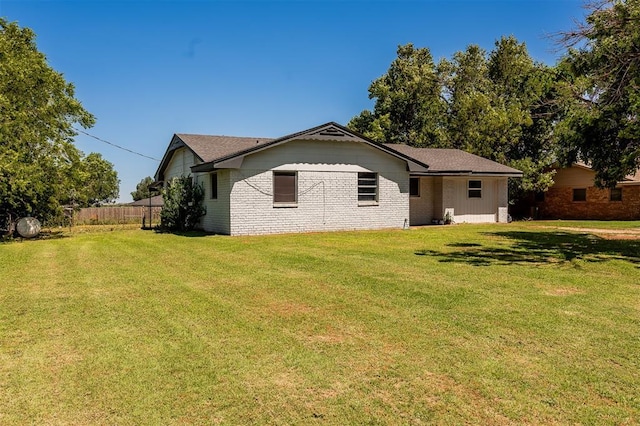 2120 E Robberts Ave, Kingfisher, OK 73750 - rear view of house with brick siding
