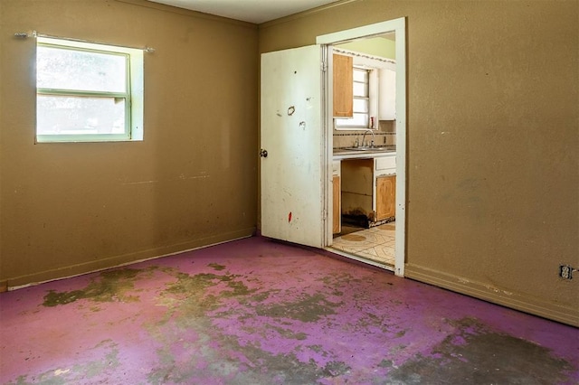 2120 E Robberts Ave, Kingfisher, OK 73750 - unfurnished room featuring a sink and baseboards