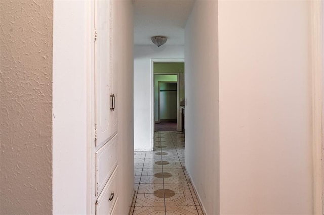 2120 E Robberts Ave, Kingfisher, OK 73750 - hallway featuring light tile patterned floors and baseboards