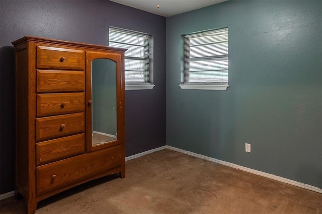 2120 E Robberts Ave, Kingfisher, OK 73750 - unfurnished bedroom featuring carpet and baseboards