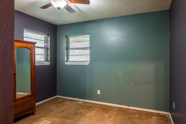 2120 E Robberts Ave, Kingfisher, OK 73750 - carpeted empty room with ceiling fan and a textured ceiling