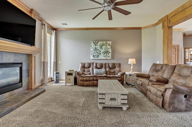 1716 NW 182nd St, Edmond, OK 73012 - carpeted living area with ornamental molding, ceiling fan, and a tiled fireplace