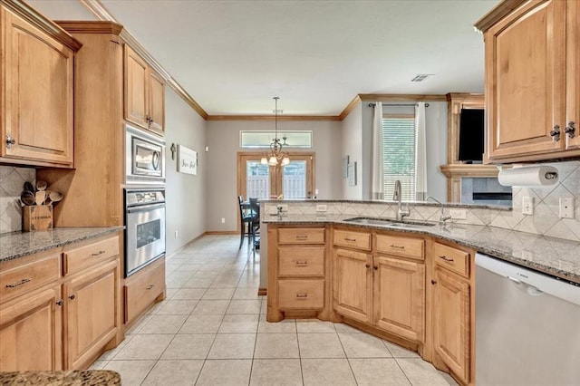 1716 NW 182nd St, Edmond, OK 73012 - kitchen with stainless steel appliances, a peninsula, decorative backsplash, light tile patterned floors, and ornamental molding
