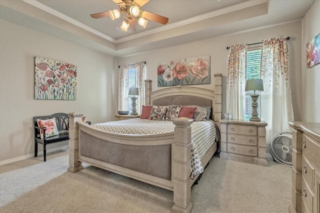 1716 NW 182nd St, Edmond, OK 73012 - carpeted bedroom featuring crown molding, a tray ceiling, and ceiling fan