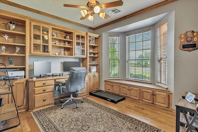 1716 NW 182nd St, Edmond, OK 73012 - office space featuring light wood-type flooring, ceiling fan, ornamental molding, built in desk, and a textured wall