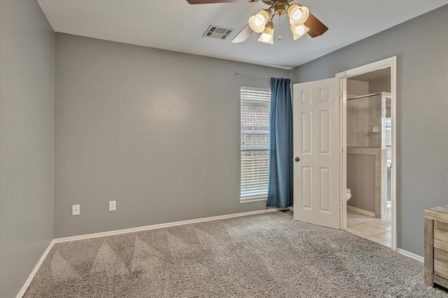 1716 NW 182nd St, Edmond, OK 73012 - unfurnished bedroom featuring carpet, ensuite bath, and a ceiling fan
