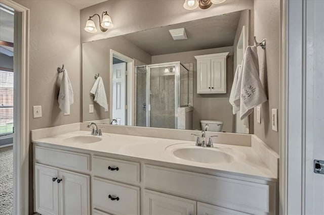 1716 NW 182nd St, Edmond, OK 73012 - bathroom featuring a shower stall and double vanity