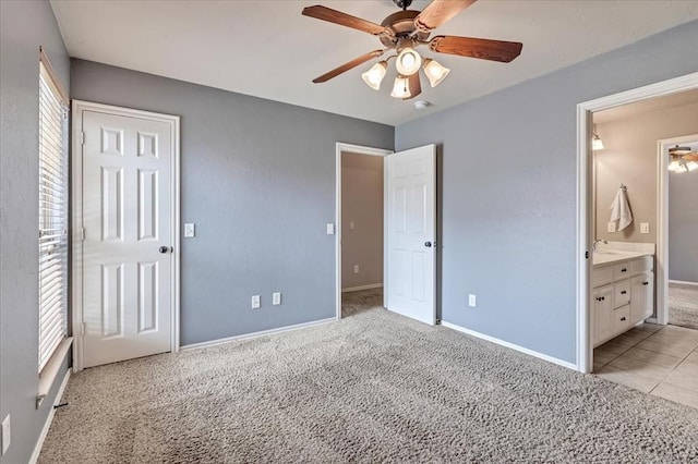 1716 NW 182nd St, Edmond, OK 73012 - unfurnished bedroom with light colored carpet, ensuite bath, and ceiling fan
