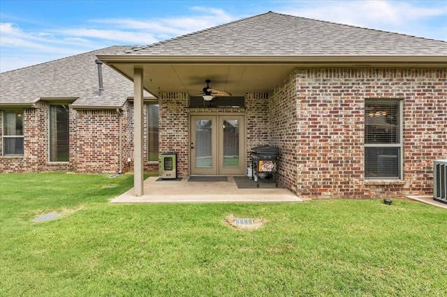 1716 NW 182nd St, Edmond, OK 73012 - back of house with ceiling fan, a shingled roof, and brick siding