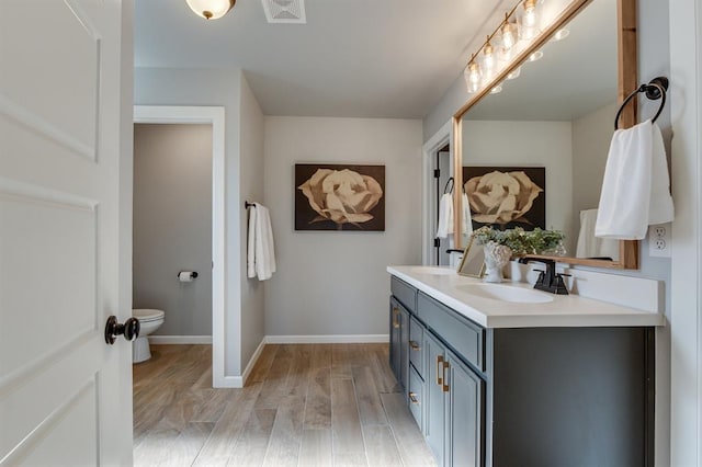 6420 SE 88th St, Oklahoma City, OK 73135 - bathroom featuring double vanity and wood finished floors